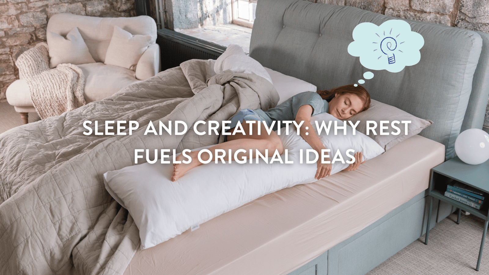 A young woman sleeps on a large pillow in a cozy bedroom. A thought bubble shows an idea icon.