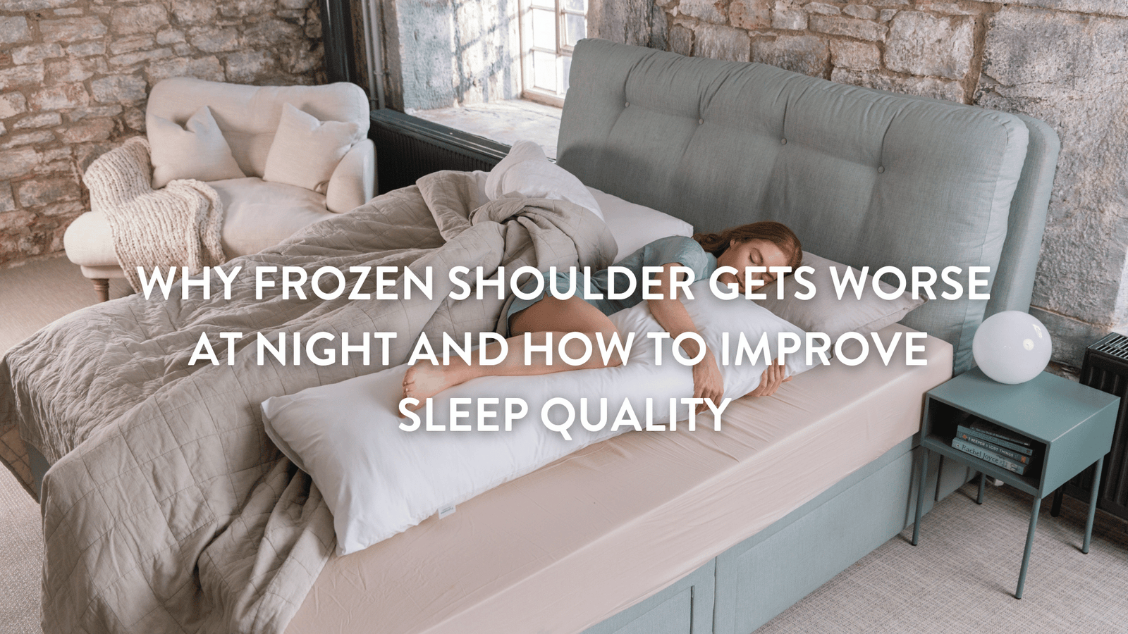 Person sleeping in bed, with frozen shoulder pain, surrounded by pillows hugging a Putnams Body pillow