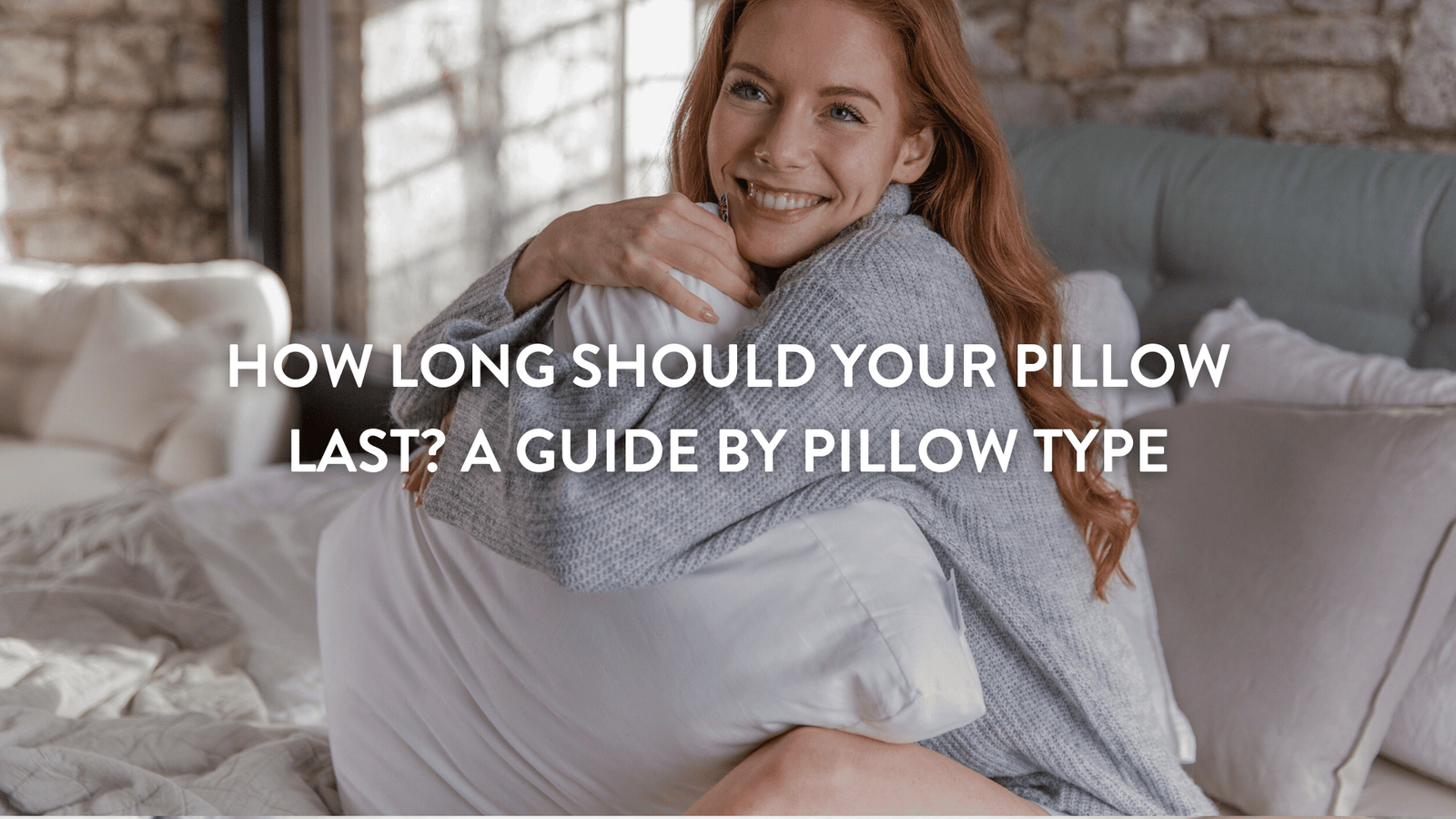 person sitting in bed hugging a putnams pillow
