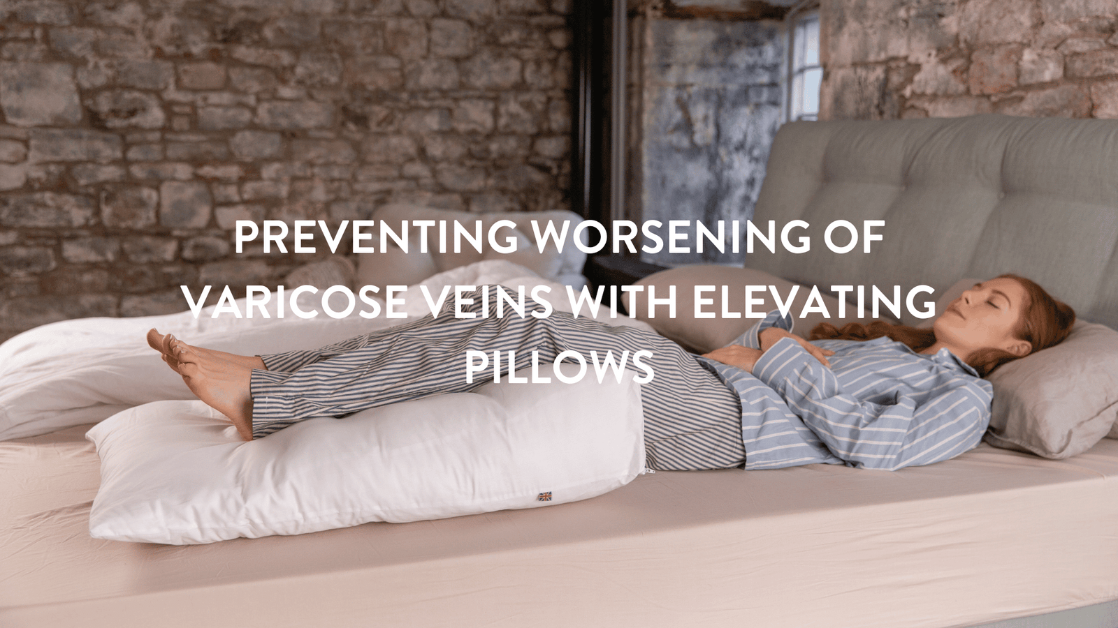Person lying in bed with their legs raised on a Putnams organic wool pillow wedge