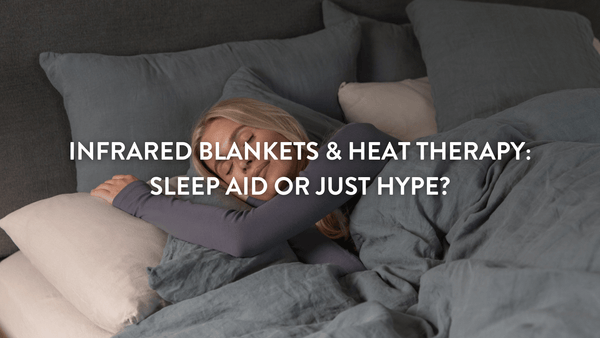 person sleeping in bed on Putnams pillows under a grey duvet