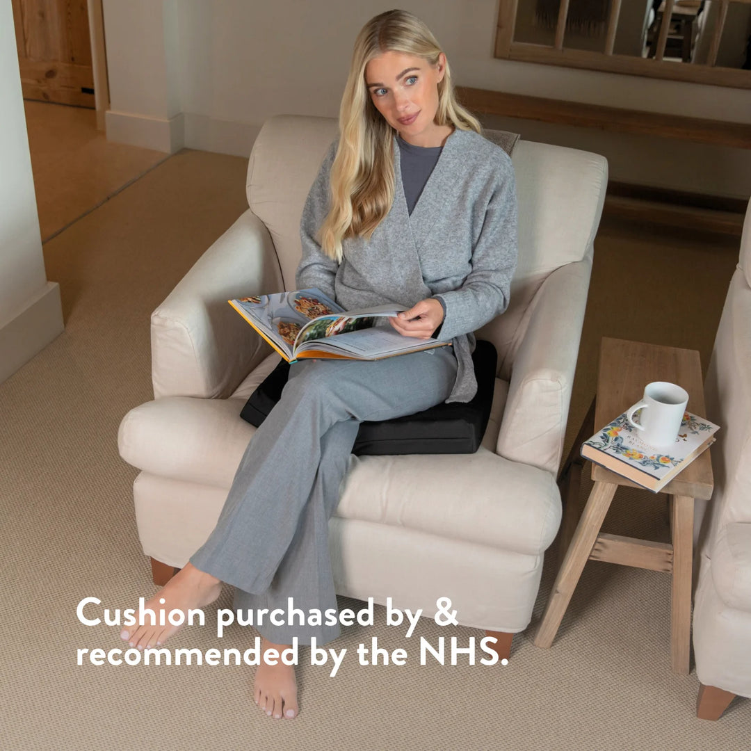 Tailbone Pain Cushion with a cut out for pressure relief at the back of the cushion. Stretch navy blue or black cover available in different sizes. High density foam with a 2 year guarantee.