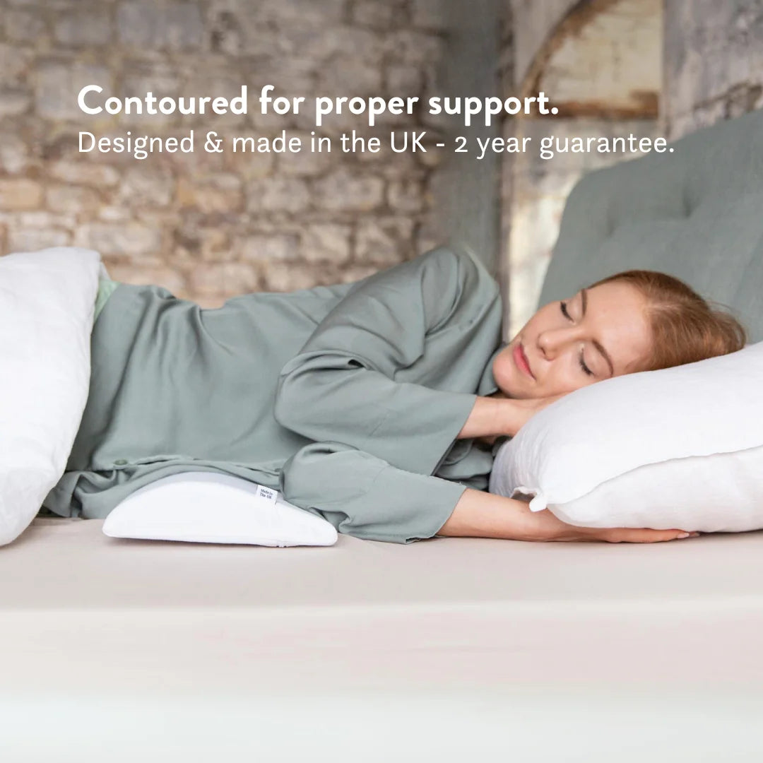 Bed Back Support Pillow - Putnams Place this D shaped firm pillow under the small of your back to support the natural S shape of the spine during sleep. Gives pressure relief to the back when in pain.